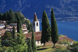 ITALY, Lombardy, Lake Garda, "Pieve.  View of tiled rooftops, church and bell tower of village