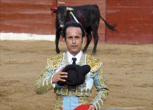 MEXICO, Jalisco, Puerto Vallarta, Bullfight. A matador salutes the presiding dignitary before the