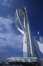 ENGLAND, Hampshire, Portsmouth, Gunwharf Keys. The Spinnaker Tower seen against a blue sky.
