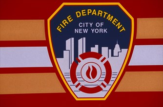 USA, New York, New York City, Detail of New York fire department badge on side of fire engine or