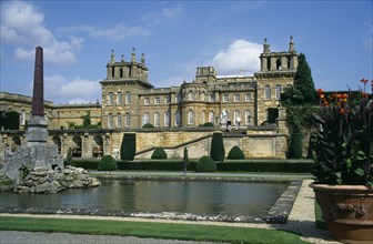ENGLAND, Oxfordshire, Woodstock, Blenheim Palace. View across formal gardens towards the Bernini