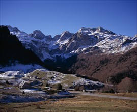 FRANCE, Aquitaine, Pyrenees Atlantiques, Winter view west from village of Peyrenere near mountain