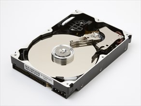 TECHNOLOGY, IT, Computers, Open computer hard drive showing disc and read write mechanism