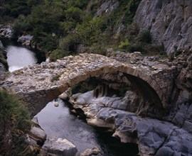 FRANCE, Languedoc-Roussillon, Pyrenees-Orientales, “Clue de la Fou”.  Roman bridge across the River