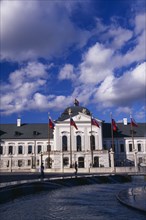 SLOVAKIA, Bratislava, "Presidential Palace, part view of exterior facade with flags.  Circular