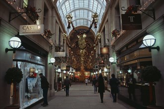 ENGLAND, Nottinghamshire, Nottingham, Exchange Arcade interior decorated at Christmas with people