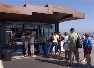 ENGLAND, West Sussex, Littlehampton, Customers queuing at the East Beach Cafe designed by Thomas