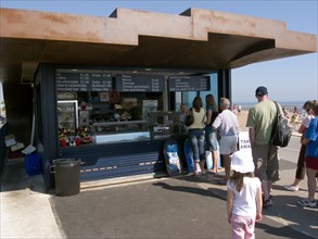 ENGLAND, West Sussex, Littlehampton, Customers queuing at the East Beach Cafe designed by Thomas