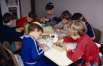 ENGLAND, Religion, Judaism, Sunday School pupils making greetings cards for Jewish New Year.