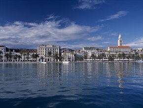 CROATIA, Dalmatia, Split, Harbour and waterfront with St Domnius Cathedral spire behind
