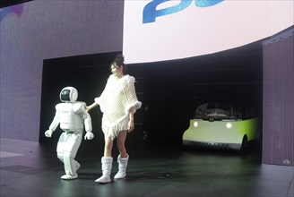 JAPAN, Honshu, Chiba, "Tokyo Car Show, Asimo Robot and young woman introduce Honda concept car