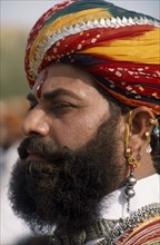 INDIA, Rajasthan, Jaisalmer, Head and shoulders side profile portrait of a Mr Desert contestant