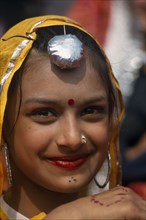 INDIA, Punjab, Kila Raipur, Portrait of a young girl dancer smiling at the Rural Sports Festival