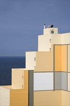 MALTA, Paceville, Stepped structure of seaside building with pattern of square coloured decoration