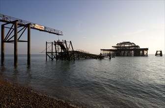 ENGLAND, East Sussex, Brighton, Remains of West Pier after fire destroyed the structure.