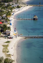 WEST INDIES, St Lucia, Gros Islet , "The coconut palm tree lined beach at Sandals Grande St Lucian