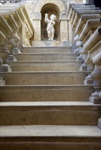 MALTA, Mdina, The Silent City. Statue of a cherub at the top of stone steps in the Fontanella