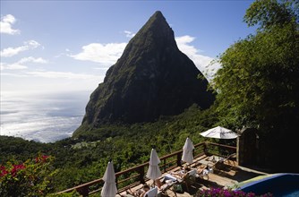 WEST INDIES, St Lucia, Soufriere , Val des Pitons Tourists sunbathing on the sun deck beside the