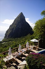 WEST INDIES, St Lucia, Soufriere , Val des Pitons Tourists sunbathing on the sun deck beside the