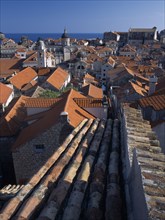CROATIA, Dalmatia, Dubrovnik, "Elevated view over terracotta roof tops towards the Cathedral, St