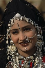 INDIA, Rajasthan, Jaisalmer, Head and shoulders portrait of a Miss Desert contestant  wearing
