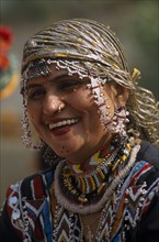 INDIA, Rajasthan, Alwar, Portrait of a Kalbelia dancer women smiling at the Alwar Utsav Festival