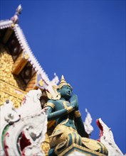 THAILAND, North, Chiang Mai, "Green and gold painted statue of Rama, an incarnation of Vishnu often