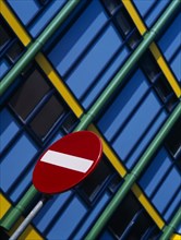 HOLLAND, Noord Holland, Amsterdam, Detail of No Entry road sign with modern colourful apartments