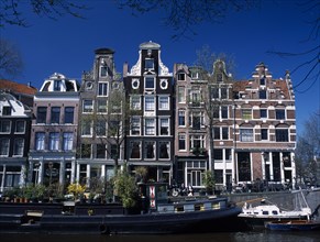 HOLLAND, Noord Holland, Amsterdam, Traditional canal side house facades in the Brouwergracht Canal