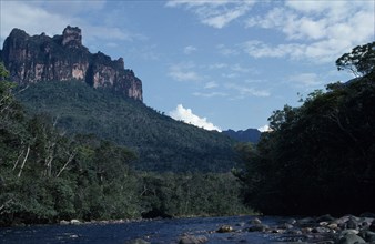 VENEZUELA, Estado Bolivar, Rio Carrao, "River flowing through tree covered landscape overlooked by