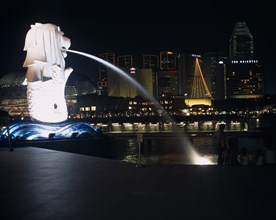 SINGAPORE, Merlion Park, "The Merlion statue at the Merlion Park river entrance at night with the