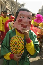THAILAND, North, Chiang Mai, "Chinese New Year celebrations. Dwarf in parade, Warorot Market area
