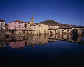 FRANCE, Midi-Pyrenees, Aveyron, "Saint-Antonin-Noble.  Village houses, church spire and bridge