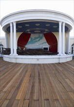 ENGLAND, West Sussex, Worthing, New decking with the bandstand full of old planks the day timber