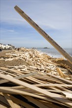 ENGLAND, West Sussex, Worthing, Timber washed up on the beach from the Greek registered Ice