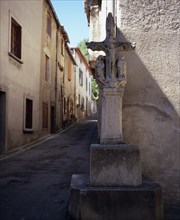 FRANCE, Languedoc-Roussillon, Aude, Mas-Cabardes.  Village street corner with Croix de la
