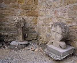 FRANCE, Languedoc-Roussillon, Aude, Montmaur.  Disc shaped crosses outside the Eglise St Baudile