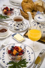 ENGLAND, Food, Meals, "Breakfast table setting with fresh fruit in a bowl, orange juice in a glass,