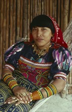 PANAMA, San Blas Islands, Kuna Indigenous Tribe, "Portrait of a Kuna Indian woman in hammock  with