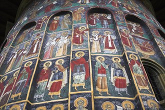 ROMANIA, Moldavia, Bucovina, "Several colourful frescoes on outside wall, Sucevita Monastery,