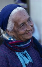 MEXICO, Oaxaca, Juchitan, Matriarchal society.  Head and shoulders portrait of elderly woman with