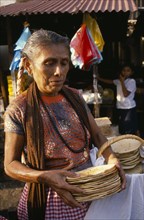 MEXICO, Food and Drink, Woman selling tortillas at market.