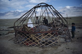 20088823 AFGHANISTAN  Architecture Kirghiz people erecting frame for yurt.
