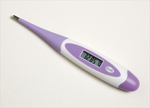 MEDICAL, Health, Measurement, Purple digital thermometer showing scale reading in degrees celcius