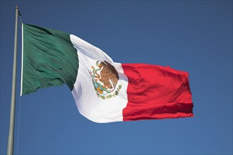 MEXICO, Mexico City, "Mexican flag on Palacio Nacional, Presidential Palace, Zocalo, Plaza de la