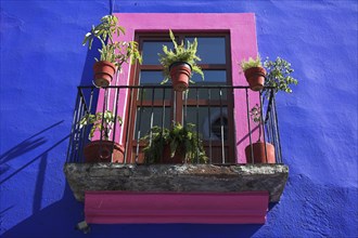 MEXICO, Puebla, Colourful balcony of a typical house near the Zocalo