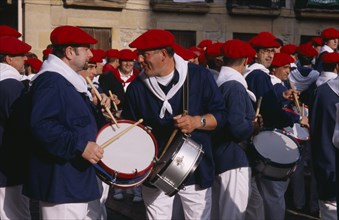 SPAIN, Pais Vasco, Hondarribia, Drummers at annual festival celebrating the defeat of the French