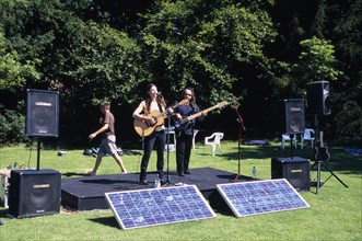 ENGLAND, East Sussex, Lewes, Guitar festival performers with solar powered amplifier systems.