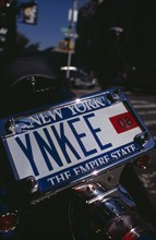 USA, New York, New York City, Detail of motorbike number plate YNKEE