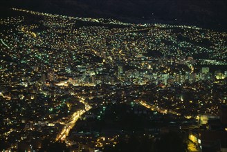 20088633 BOLIVIA  La Paz Illuminated cityscape at night.